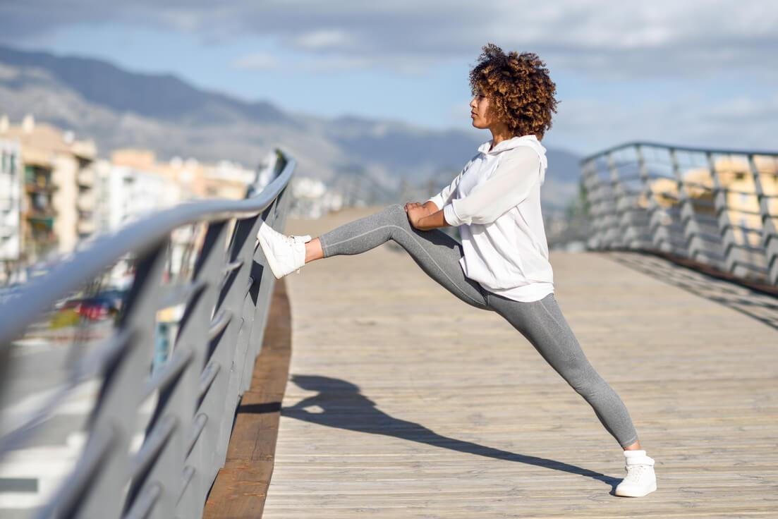 woman that exercises regularly stretching after working out