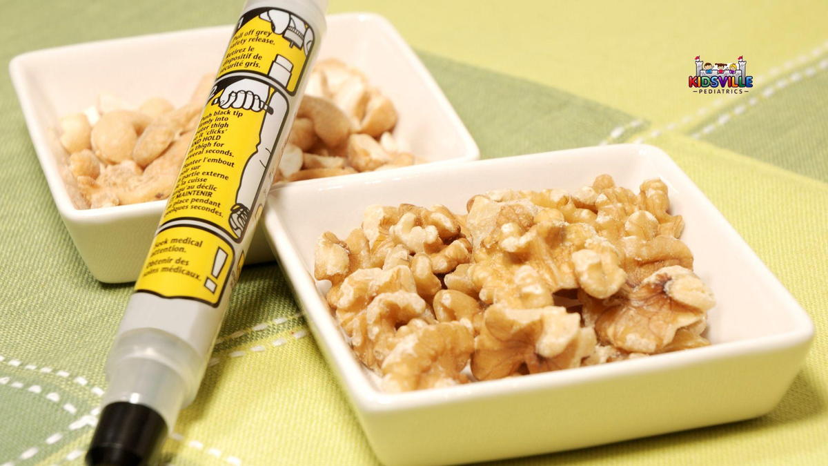 A white bowl filled with walnuts and an Epipen placed beside it.