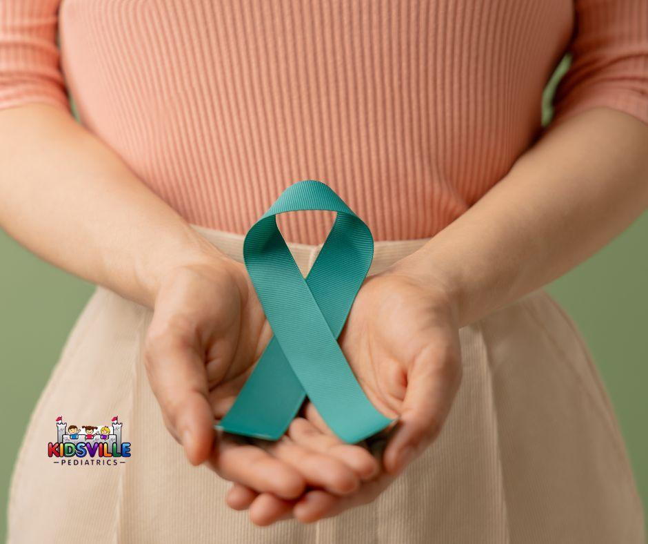 Woman holding teal awareness ribbon, symbolizing support for ovarian cancer patients.