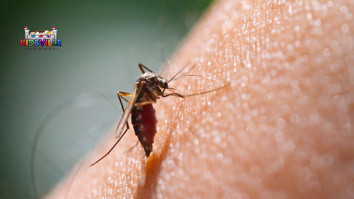 Close-up of mosquito bites on a person's arm.