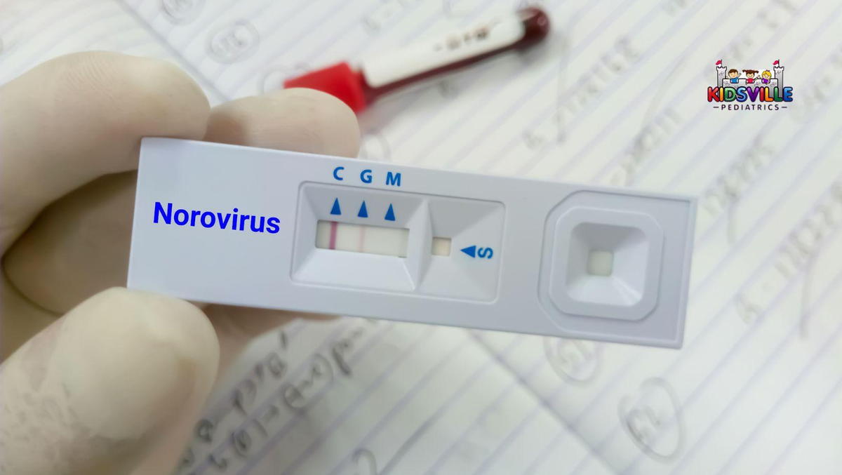 A person with a norovirus test kit.