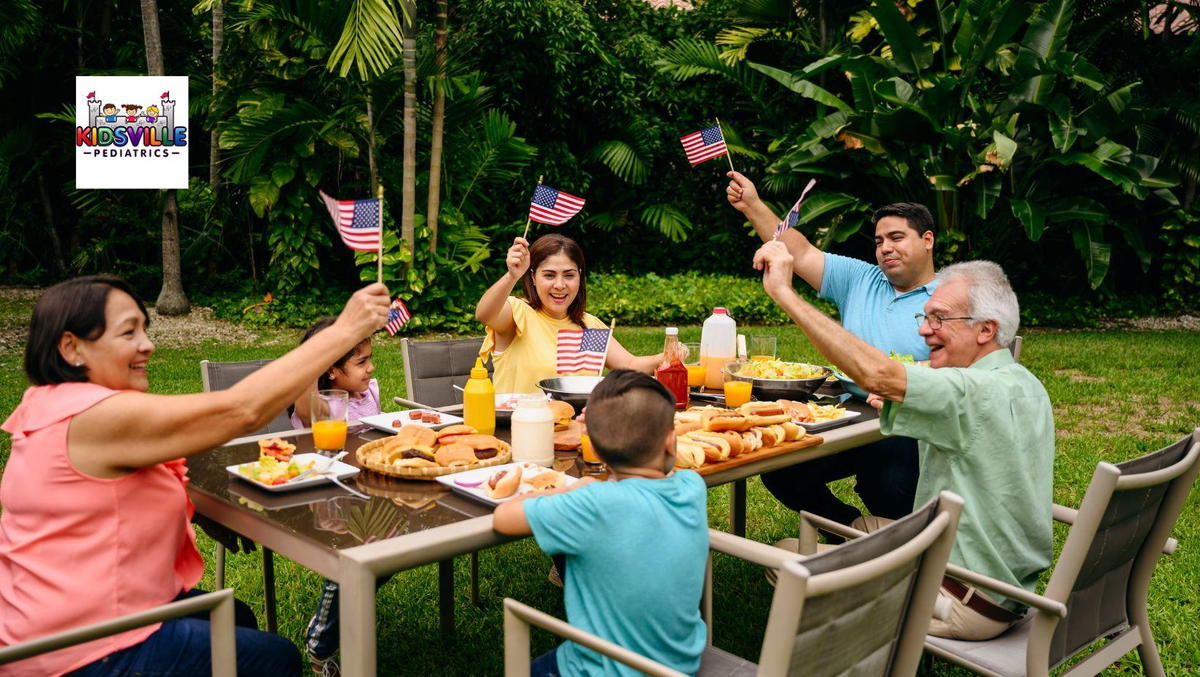 Family enjoying picnic outdoors with American flags in background.