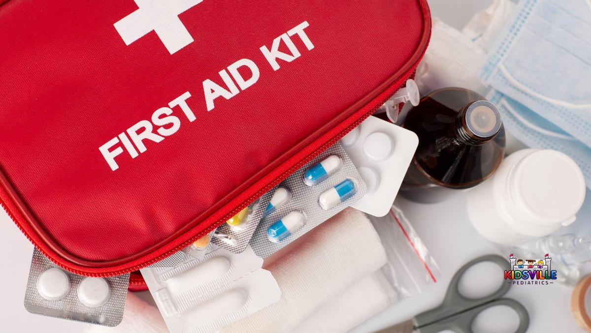 Colorful first aid kit designed for children, includes bandages, ointments, and safety scissors.