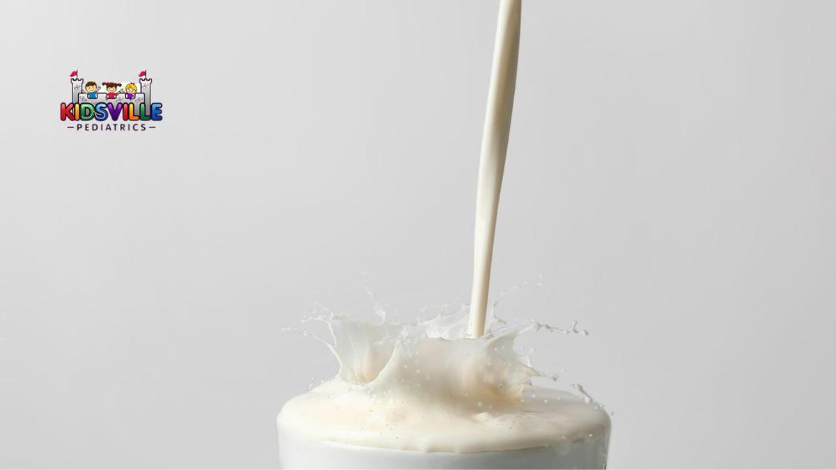 Milk being poured into a glass.