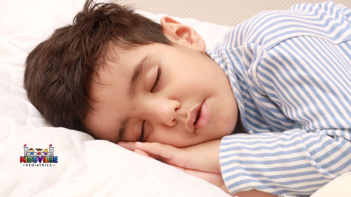 A young boy sleeping.