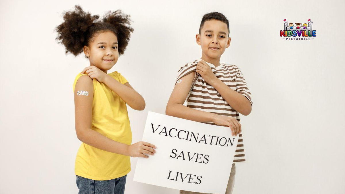 Two children holding a vaccination sign.