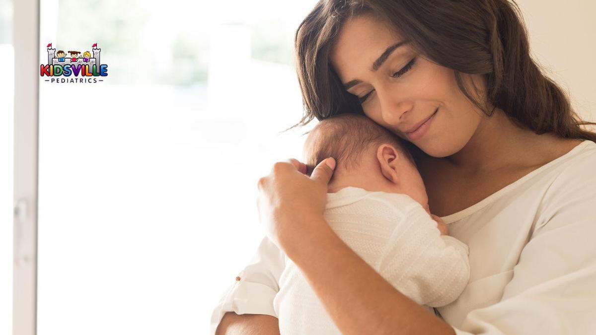 A smiling woman cradles her baby in her arms, radiating warmth and joy in a tender moment of motherhood.