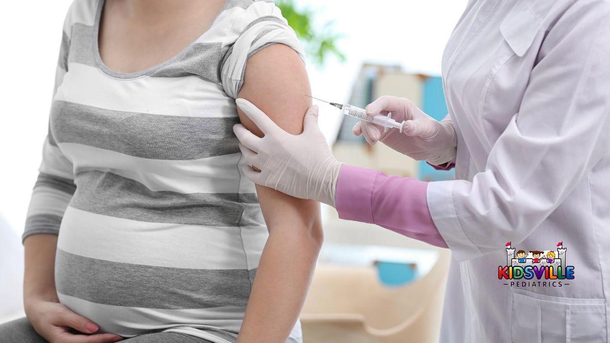 A pregnant woman receives an injection from a doctor in a clinical setting