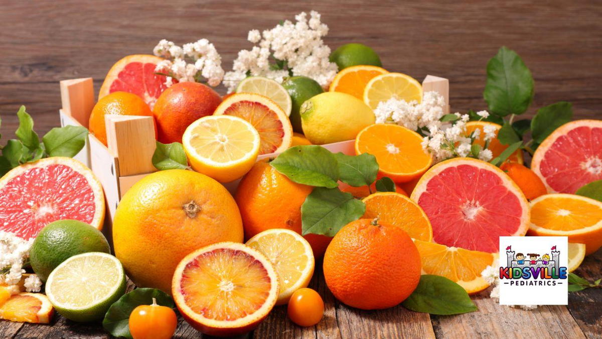 A vibrant pile of oranges, lemons, and limes stacked together, showcasing their bright colors and fresh appearance.