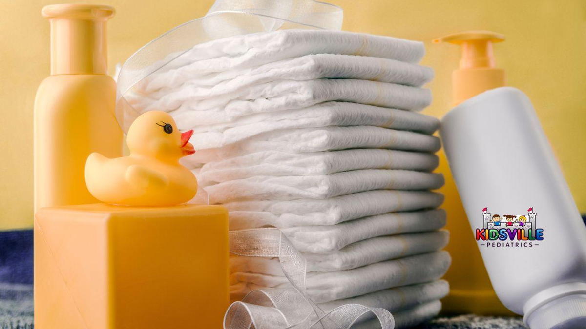 A neatly arranged stack of diapers next to a bright rubber duck, powder, and other infant and toddler essentials.