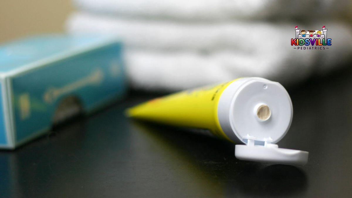 A tube of cream rests on a table.