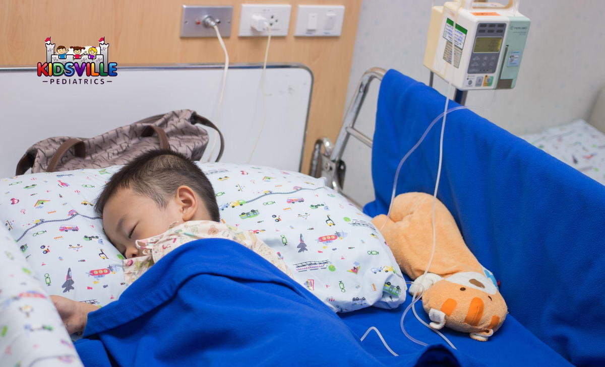 A peaceful child rests in a hospital bed, connected to an IV, surrounded by soft blankets and gentle lighting.