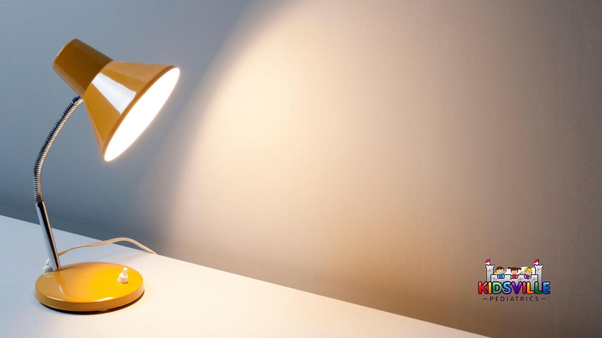 A desk lamp at the edge of a table.