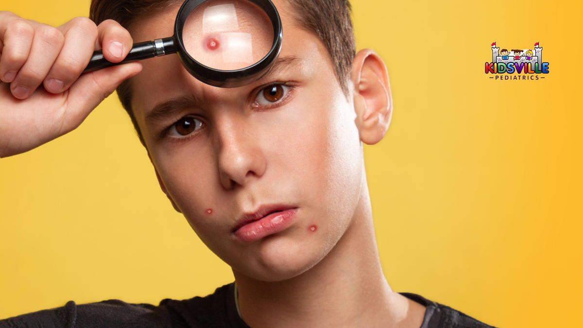 A teenage boy with pimples.