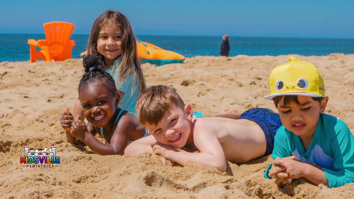 Children Playing at the sunny beach.