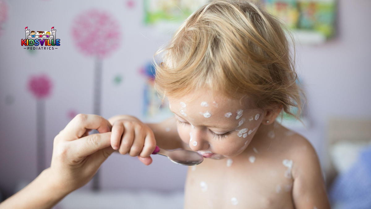 Little girl taking chickenpox medication.