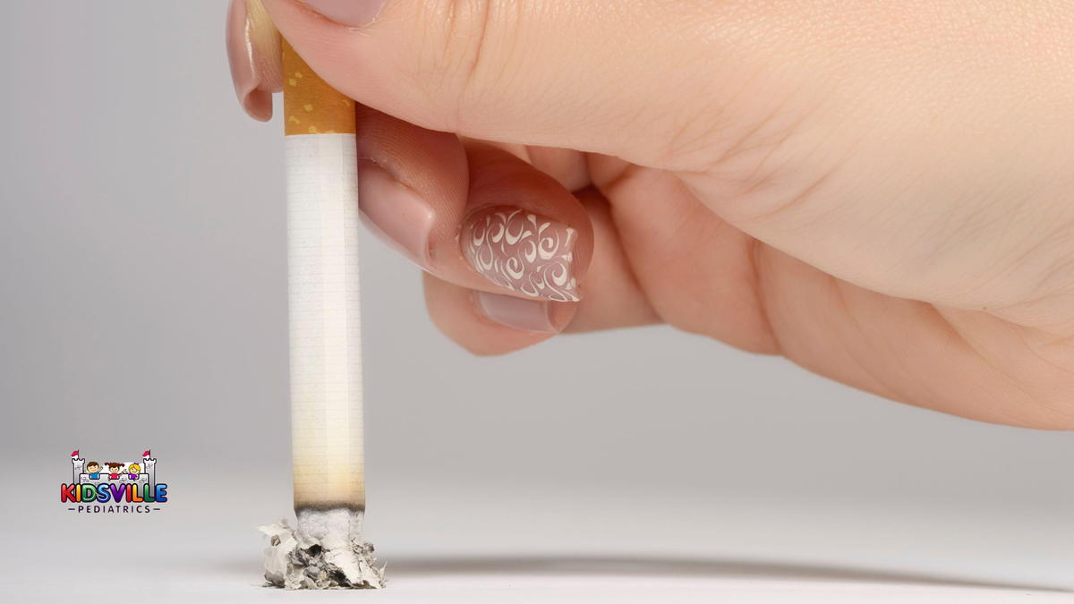 Lady with manicured fingernails presses her cigarette to the table.