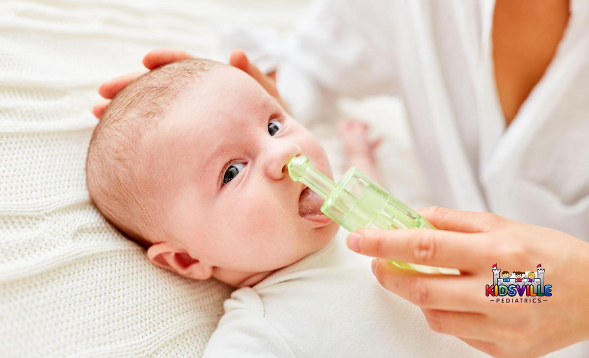 Mother Cleans Nose of Baby with Nasal Aspirator