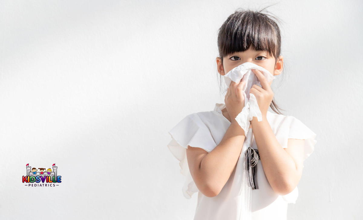 Asian Child Girl Sick with Sneezing on the Nose and Cold Cough O