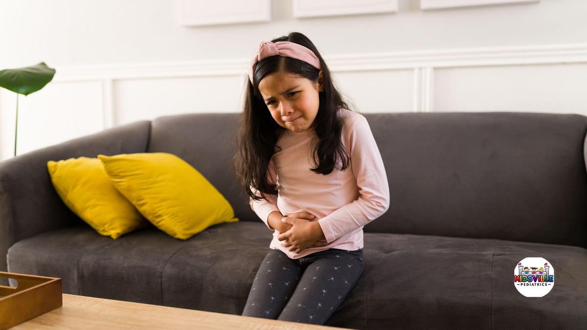 Sad child with a bad stomach ache.