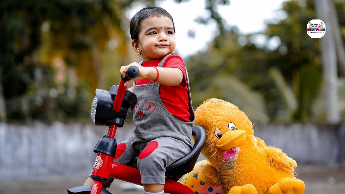 Cute Child riding a Bike Toy carrying Stuffed Toys