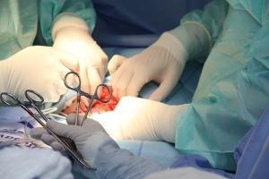 Doctors hands and instruments during a surgery