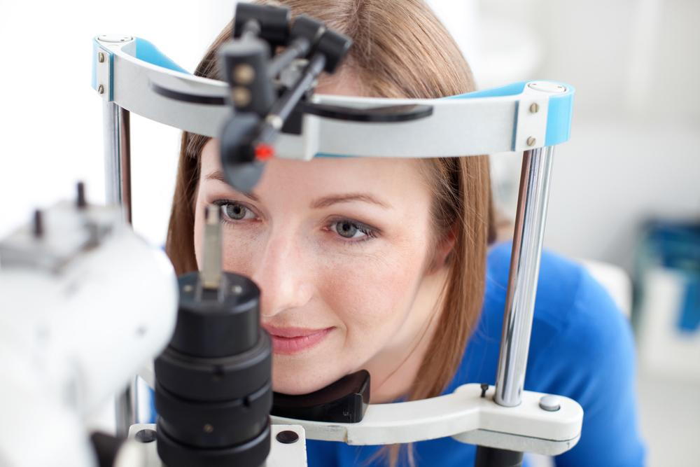 Woman getting an eye exam in May.
