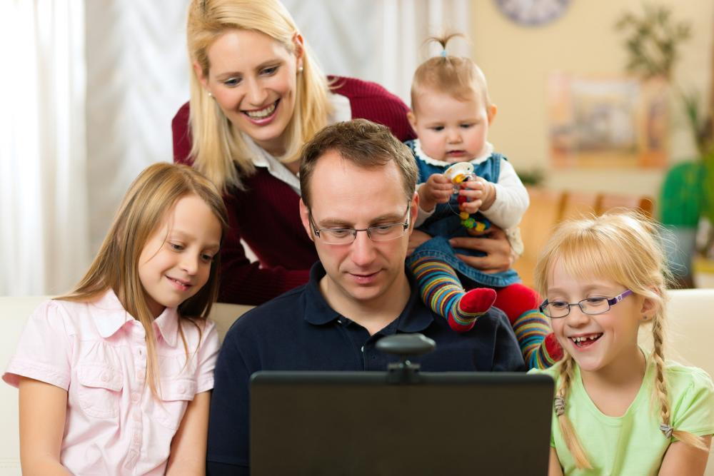 Family gathering around a computer in Ashburn