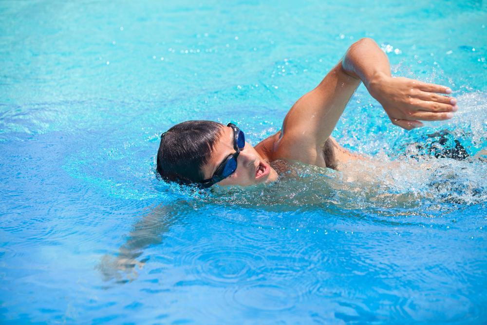Man swimming in Ashburn with goggles