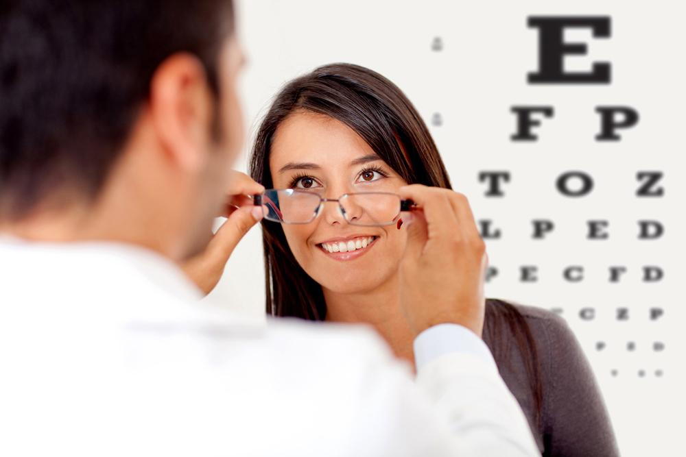 optometrist helping a patient choose eyeglasses after an eye exam in Elko, NV