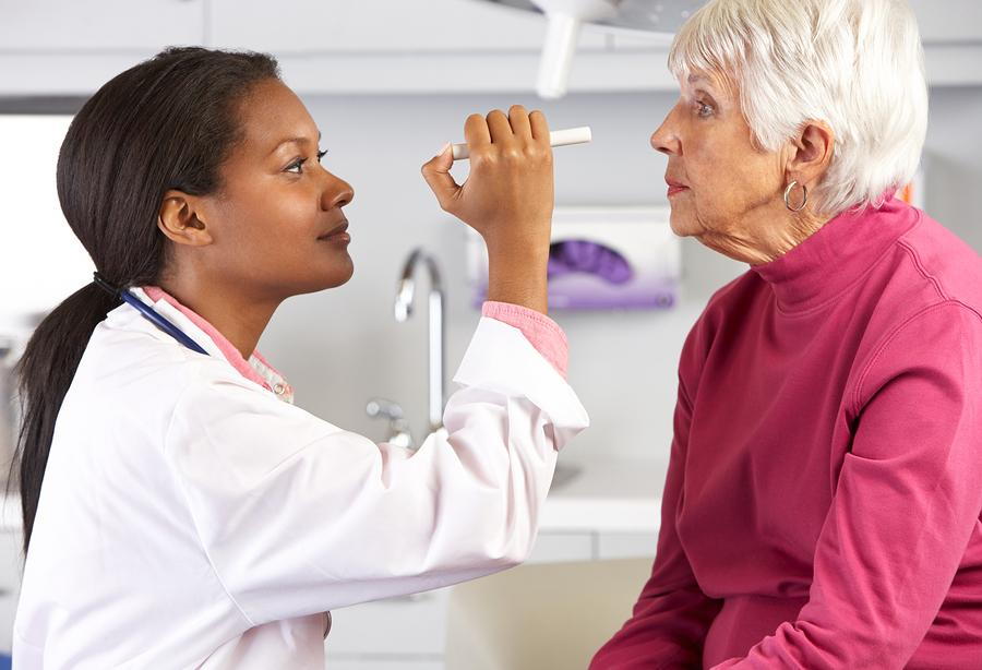 senior woman getting an eye exam