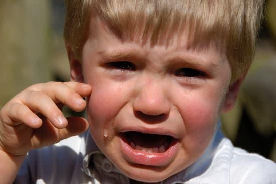 Child with ear infection crying.