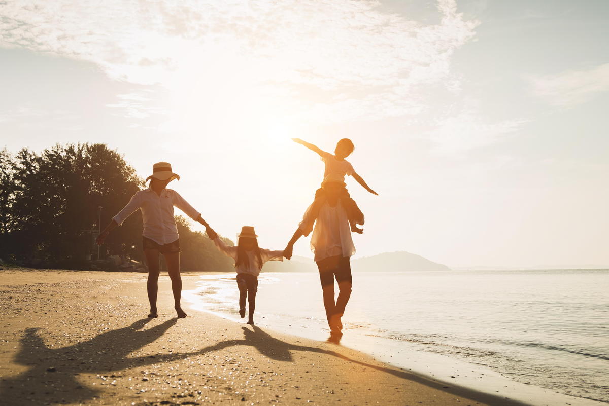 Family running along beach