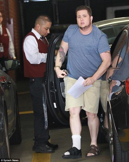 Description: Bum foot: Chaz Bono arrived in Beverly Hills on Thursday wearing a black walking brace on his foot