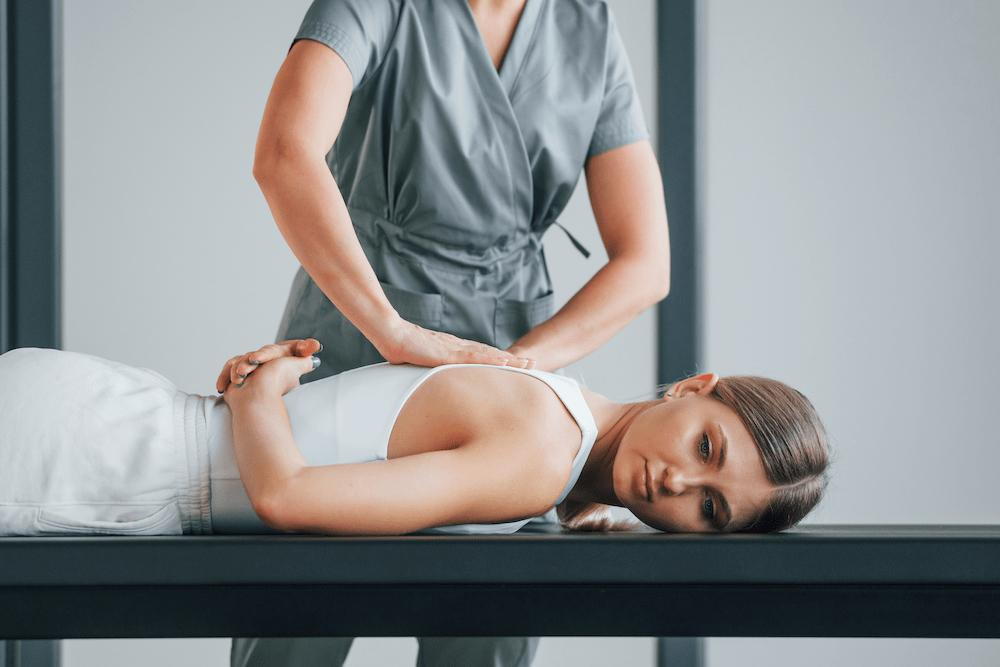 doctor making chiropractic adjustments to scoliosis patient