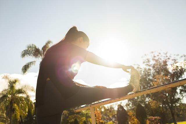 woman doing a stretch to manage lower back pain