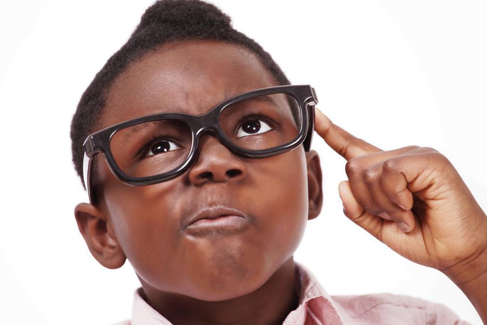 little boy in glasses after eye exam with pediatric optometrist