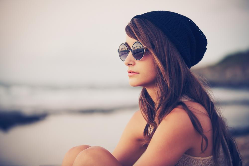 woman wearing sunglasses on the beach