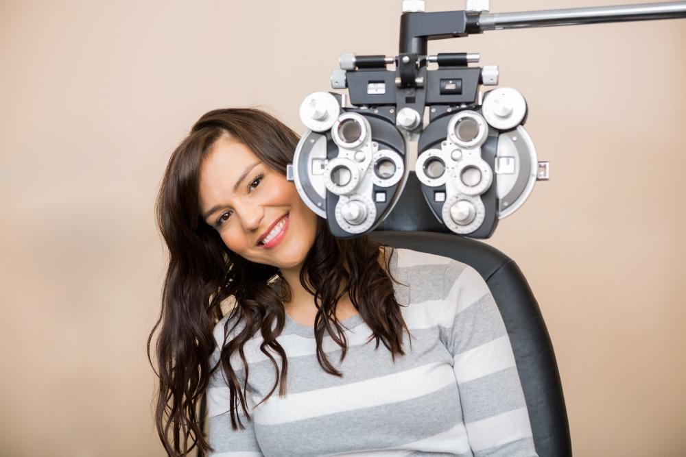 woman sitting in West Des Moines optometrist office waiting for an eye exam