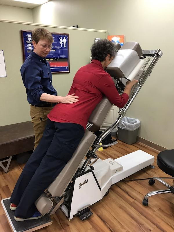 North Austin chiropractor performing chiropractic adjustment on patient
